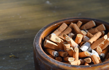 cigarette filter in ceramic ashtray