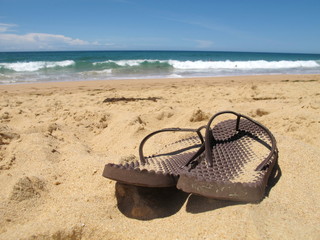 Close up flip flops on beach 2
