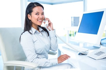 Smiling businesswoman on phone 