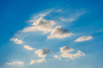 blue sky background with tiny clouds