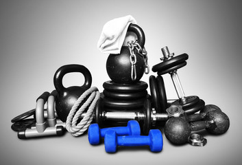 Sports equipment for bodybuilding collected in a heap