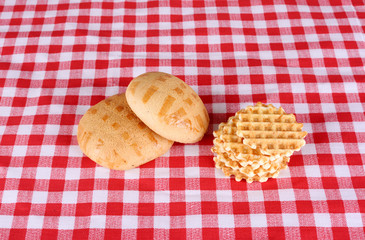 Biscuits on checkered cloth