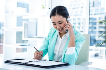 Fototapeta premium Happy businesswoman sitting down