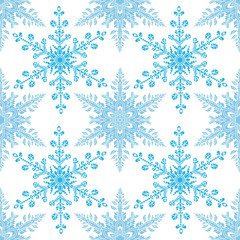 Festive seamless pattern with blue colored snowflakes on white background