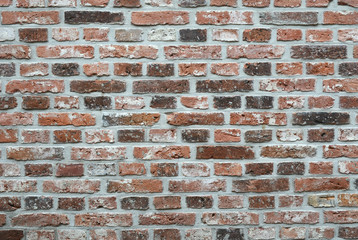 Fototapeta premium detail of a old broken damaged brick cement wall with empty roomcopy space for a abstract background