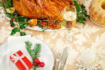Christmas dinner table with Christmas gift 