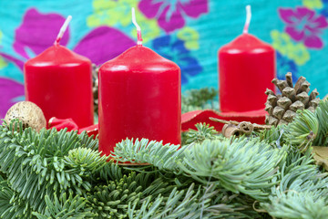 Advent wreath with red candles with green background