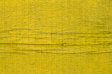New yellow painted board with knot and cracks