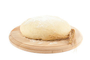 Dough for bread and wheat ears.