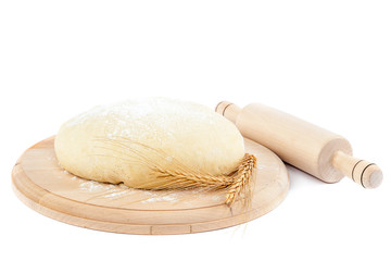 Dough for bread and wheat ears.