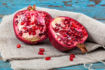 Fresh pomegranate on wooden boards.