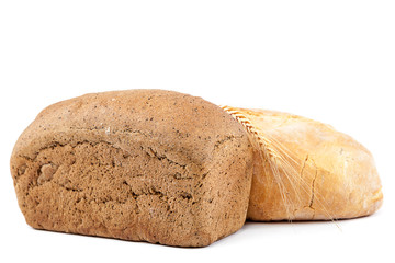 Bread and wheat ears on white background.