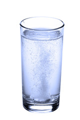 tablet in glass of water isolated on white