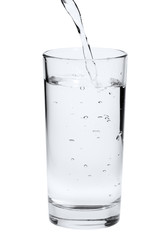 water pouring into glass isolated on white