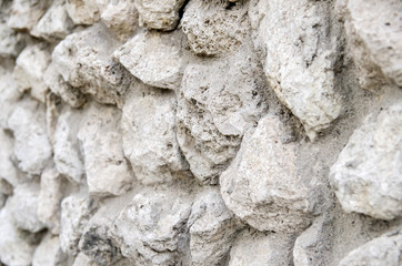 Old stone wall for texture or background, in the city
