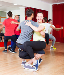 Fototapeta premium Group of people dancing salsa in studio