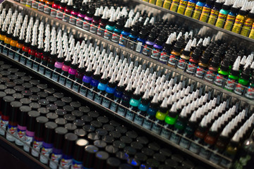 Tubes of professional tattoo paint at showcase