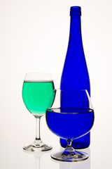 Two glasses with a bottle.