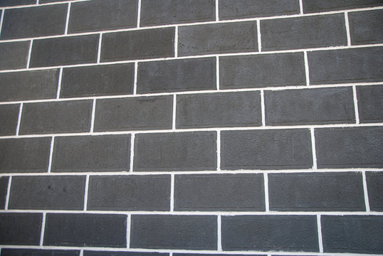horizontal part of black painted brick wall