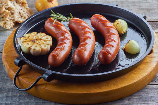 Grilled sausages with garlic and onion