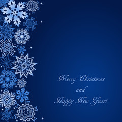 Naklejka na ściany i meble Christmas blue background with snowflakes at the side and with text