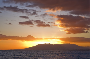 Sea sunset in a cloudy day in the golden hour