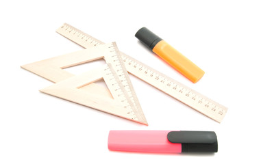 markers and wooden ruler on white