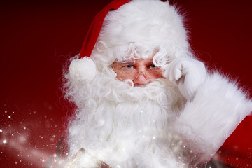 Santa Claus pointing in white blank sign with smile,christmas  