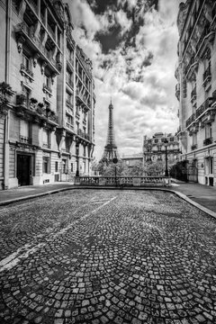 Eiffel Tower seen from the street in Paris, France. Black and white