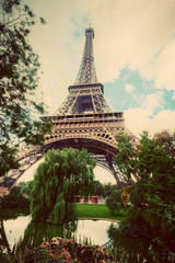 Eiffel Tower from Champ de Mars park in Paris, France. Vintage