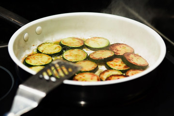 Sauteed organic zucchini squash in a frying pan