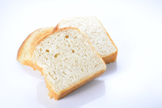 Bread cut pieces on whtie background.