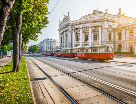 Wiener Ringstrasse with Burgtheater and tram at sunrise, Vienna, Austria