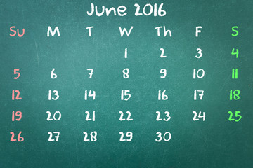 Green blackboard wall texture with a word Calender 2016 June