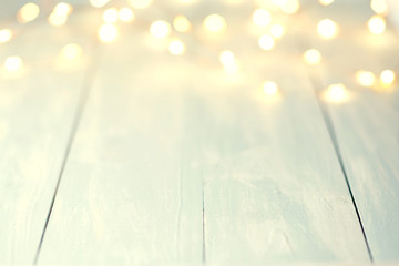 Christmas Bokeh background with empty wooden table 