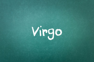 Fototapeta na wymiar Green blackboard wall texture with a word Virgo