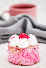 Delicious cake with sour cherries on white plate