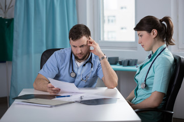 Doctor analsying patient health record