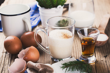 Eggnog  for Christmas, ingredients on rustic wooden table, recip