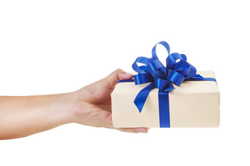 Asian hand giving a gift wrapped in nude color box with blue ribbon and bow. the most beautiful gift isolated on white background