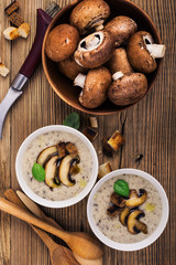 Hot homemade mushroom soup with fried mushrooms, bowl with fresh mushrooms
