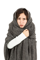 SIck woman covering herself with blanket