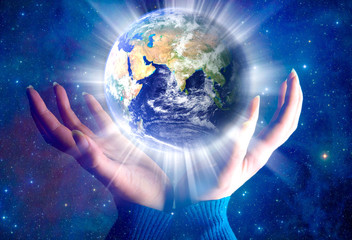 female hands with the planet Earth © starblue