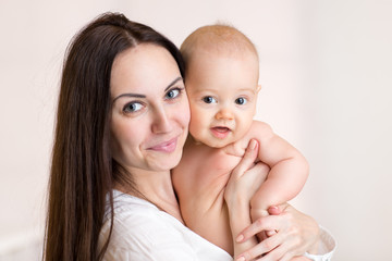 Baby and mother portrait.  Childhood, motherhood, happy family