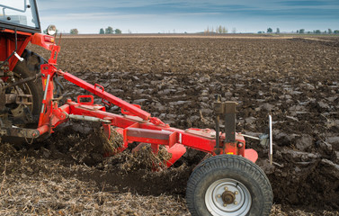 Tractor plowing field