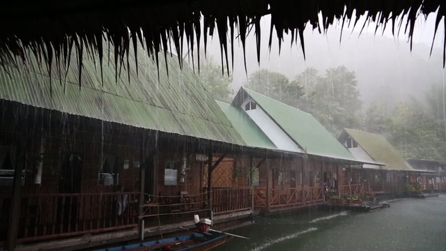 Tropical cloudburst on the Kwai river in Thailand
