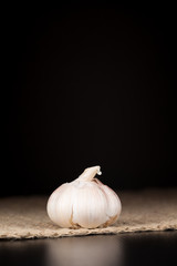 Garlic bulb on the dark background