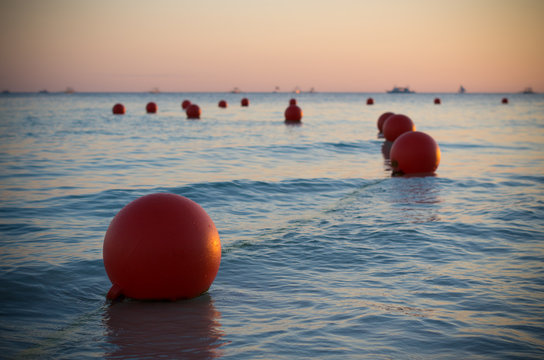 buoys at sunset