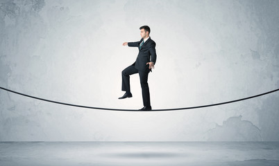 Sales guy balancing on tight rope