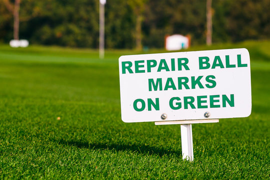 golf signs on grass